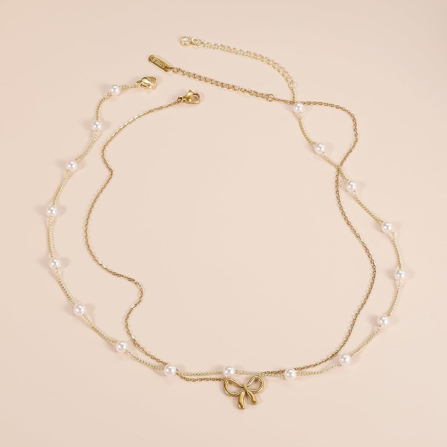 Collier choker double couche en perles simples, bijoux de mode en couleur or, chaîne avec petit pendentif en forme de nœud, cadeaux de bijoux pour femmes, bijoux de mode, cadeaux pour la Saint-Valentin.