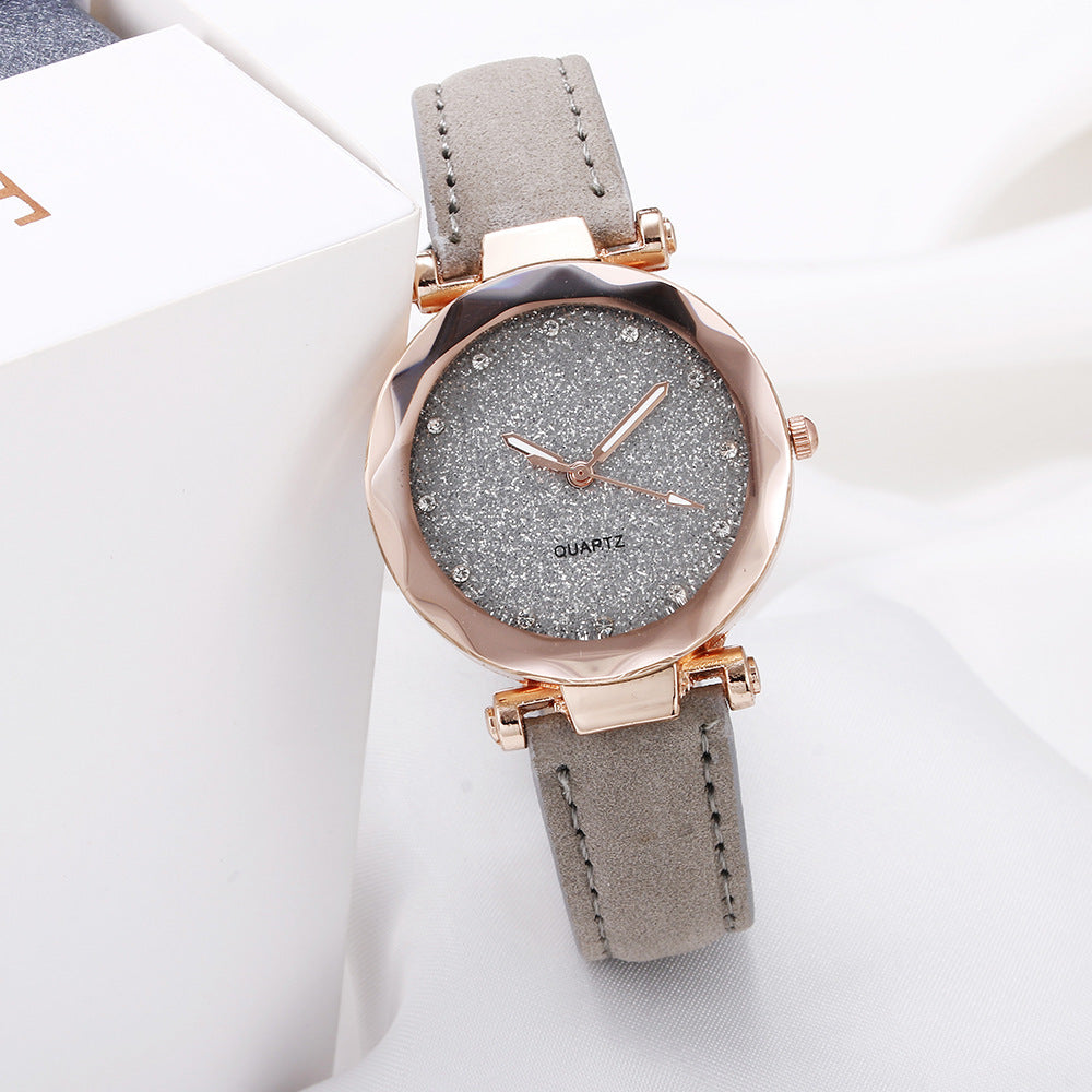 Montre-bracelet romantique pour femmes avec un ciel étoilé en cuir et des strass.