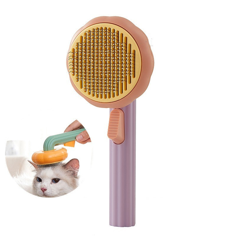 Nouvelle brosse pour chat domestique très demandée, peigne en acier à main avec système d'auto-nettoyage pour enlever les poils.