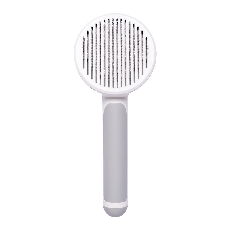 Nouvelle brosse pour chat domestique très demandée, peigne en acier à main avec système d'auto-nettoyage pour enlever les poils.