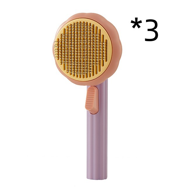 Nouvelle brosse pour chat domestique très demandée, peigne en acier à main avec système d'auto-nettoyage pour enlever les poils.