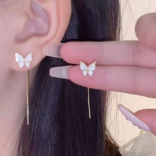 Boucles d'oreilles papillon longues à pompon en argent 925 - Ivory Deals Market