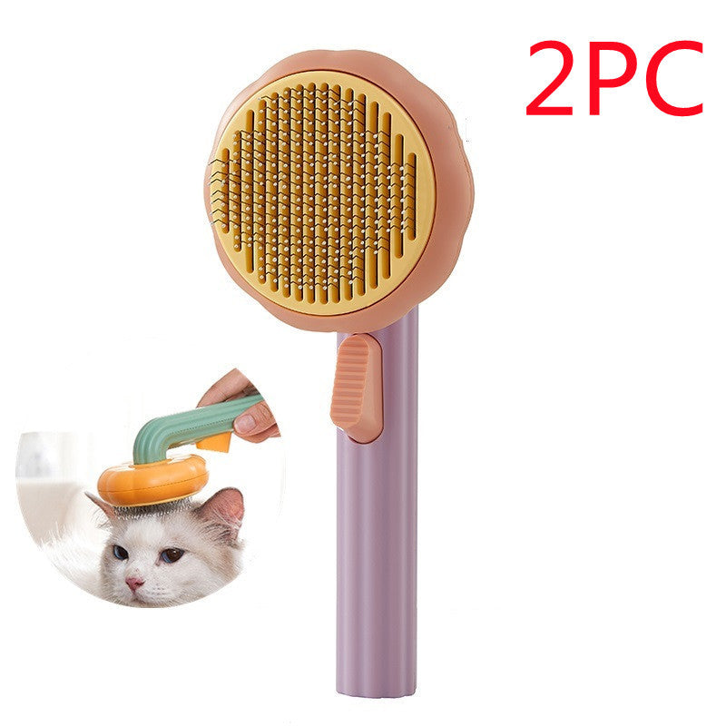 Nouvelle brosse pour chat domestique très demandée, peigne en acier à main avec système d'auto-nettoyage pour enlever les poils.